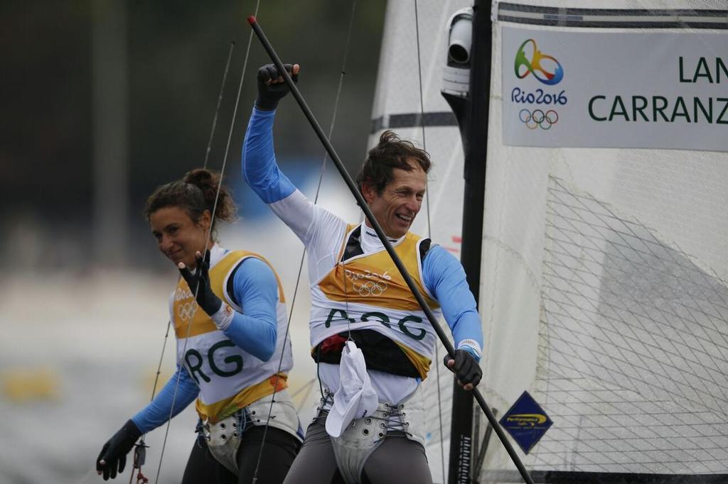 Santiago Lange celebrates with Cecilia Carranza Saroli after winning gold in the Nacra 17 class at the Rio 2016 Olympic Sailing Competition &copy; Sailing Energy/World Sailing